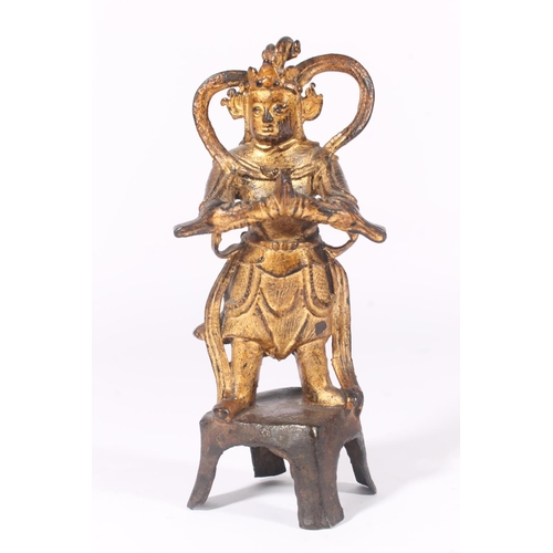 253 - Southeast Asian gilt metal figure of a deity, cast Buddha head, Roman terracotta oil lamp and a terr... 