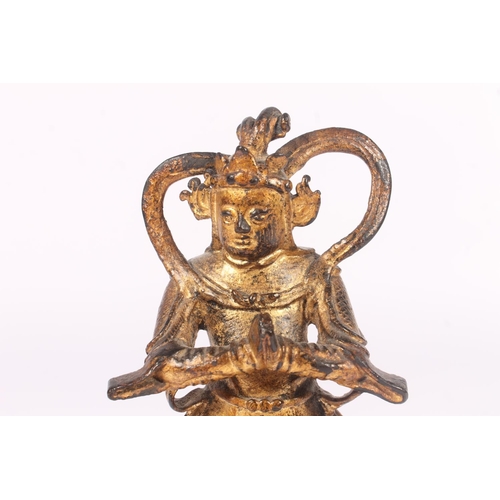 253 - Southeast Asian gilt metal figure of a deity, cast Buddha head, Roman terracotta oil lamp and a terr... 