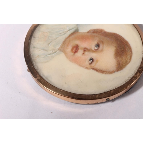 749 - Portrait miniature of a young boy in gilt metal frame and blue leatherette case.