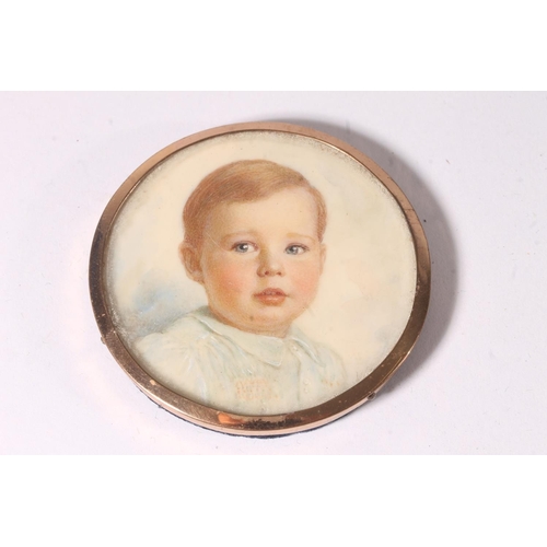 749 - Portrait miniature of a young boy in gilt metal frame and blue leatherette case.