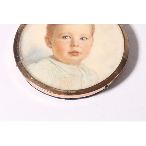 749 - Portrait miniature of a young boy in gilt metal frame and blue leatherette case.