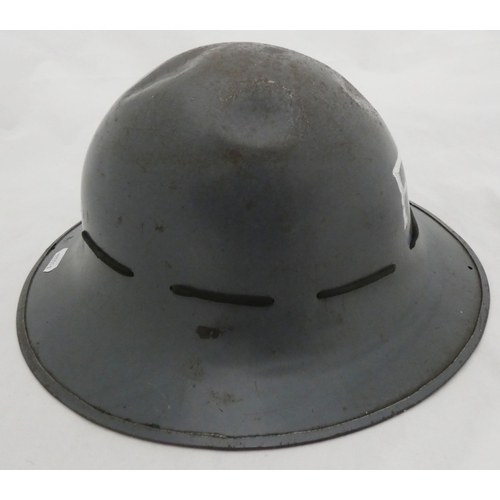 68 - WWII period fire patrol helmet, stamped '1941', with painted initials 'FP' on grey finish, bearing o... 