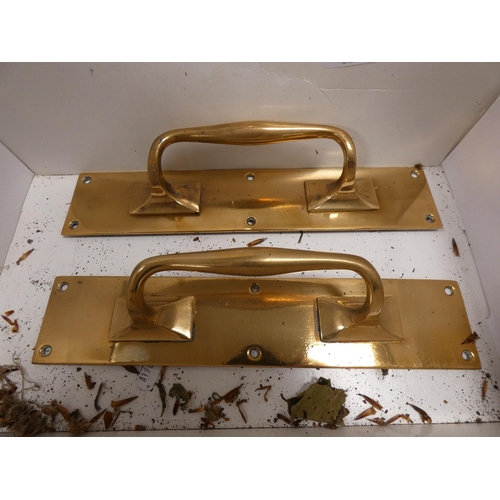 110 - Set of four matching gilt metal door handles, and other door handles.