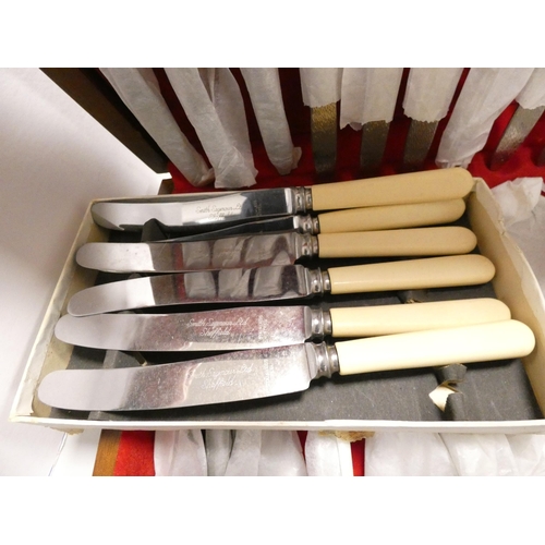 121 - Canteen of stainless steel cutlery, in fitted case, other stainless steel butter knives and another ... 