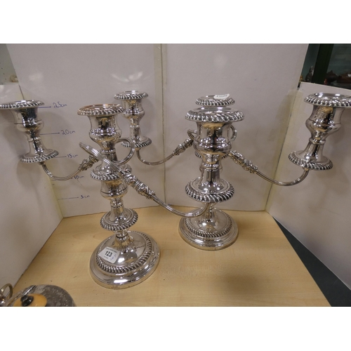 123 - Group of EP and plated ware to include a four-piece tea set, condiments, candle snuffer, ladle and t... 