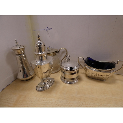 123 - Group of EP and plated ware to include a four-piece tea set, condiments, candle snuffer, ladle and t... 