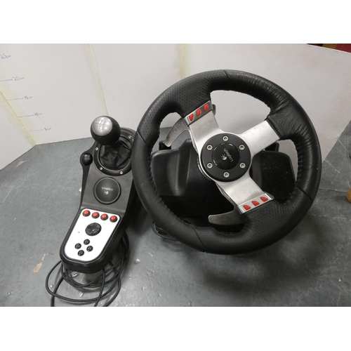 131 - Logitech G27 racing steering wheel, gear lever and foot pedals, for PC or Sony Playstation.