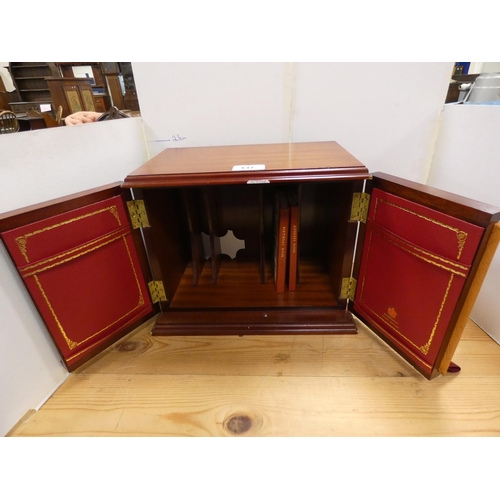 137 - Mahogany apprentice-style cabinet, the doors in the form of book spines etc.