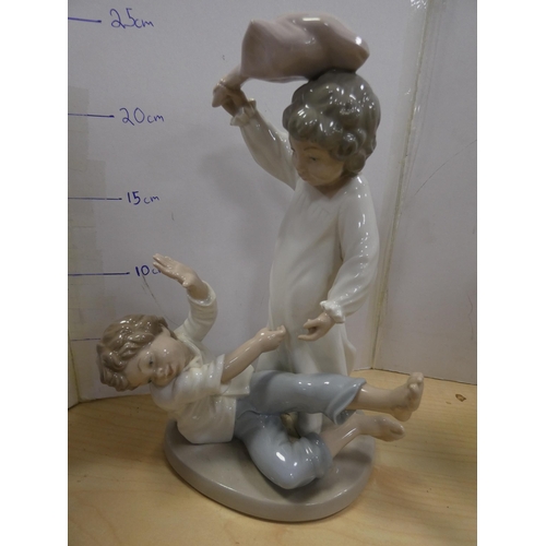 140 - Nao group of two children playing, Nao figure of a girl, another Nao figure of a girl playing a guit... 