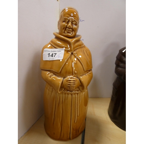 147 - Two glazed decanters, one modelled as a monk, the other as a gentleman.  (2)