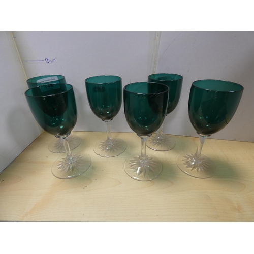 148 - Set of six green glass wine glasses with star-cut bases.