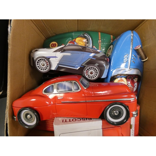 154 - Three cartons containing a large collection of chocolate and biscuit tins, mostly in the form of car... 