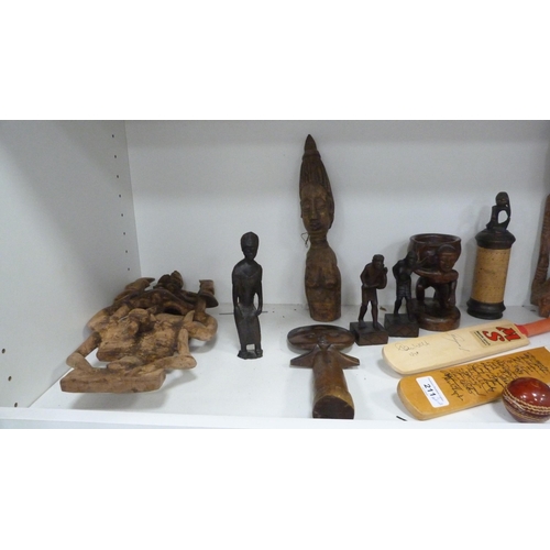 211 - Tribal African-style figures, model cricket bats and ball, banknote prints, Bibby's annual etc (two ... 