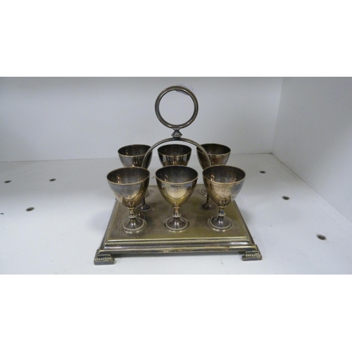 215 - Plated egg coddler, coin bank, egg cruet, three-piece tea set, silver overlaid cream and sugar etc (... 