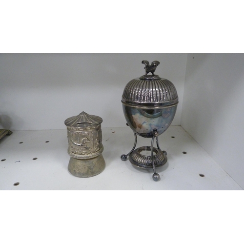 215 - Plated egg coddler, coin bank, egg cruet, three-piece tea set, silver overlaid cream and sugar etc (... 