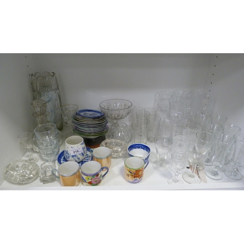 218 - Assorted glassware, coffee wares, studio pottery, ribbon plates, ashets, decanter, vase etc (two she... 