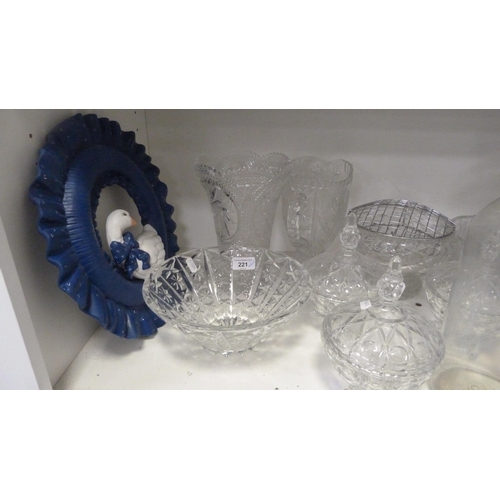 221 - Glass and crystal to include a bedroom lamp, jars and covers, cut glass vase, bowls etc., also a ste... 