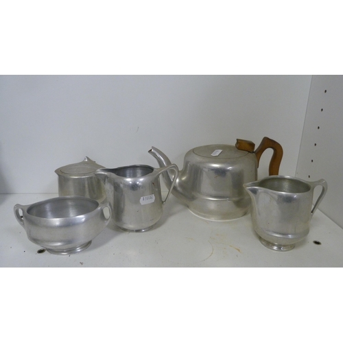 234 - Five pieces of Picquot ware, hammered pewter four-piece tea set, Spong & Co mincer, another minc... 