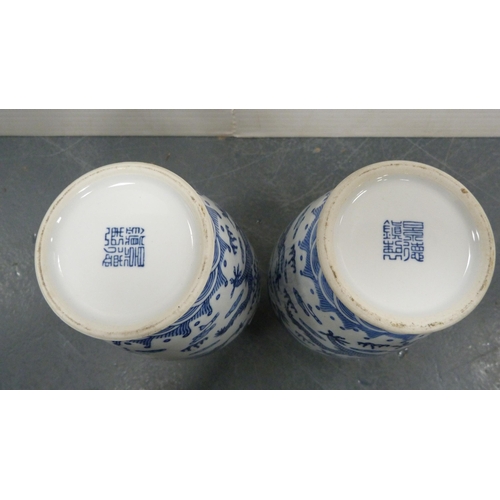 245 - Pair of Chinese Qianlong-style blue and white vases decorated with five-clawed dragon chasing the fl... 