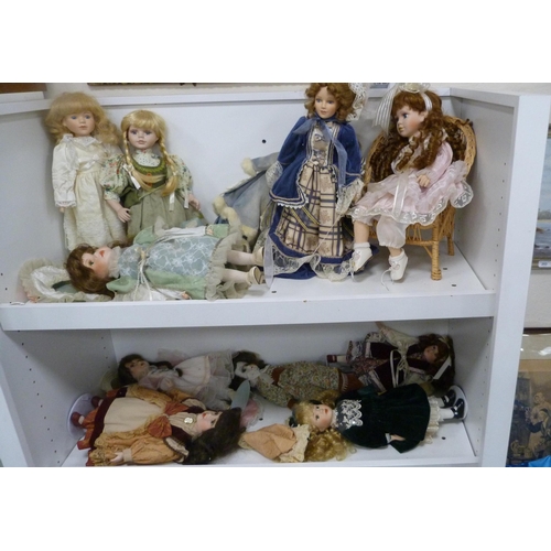 250 - Eleven porcelain-headed dolls, all with clothing, to include Stewart Ross 'Vanity Fair - Juliana' et... 