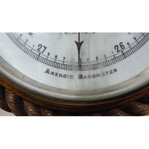 257 - Oak-framed aneroid barometer retailed by Shadburn of Sheffield.