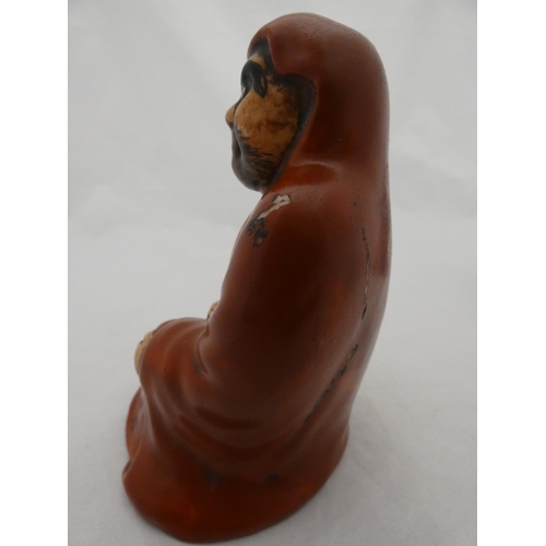 268 - Japanese glazed pottery figure of Bodhidharma, glazed in red.