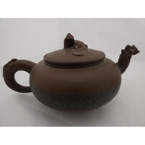 269 - Two Chinese Yixing clay teapots and covers.  (2)