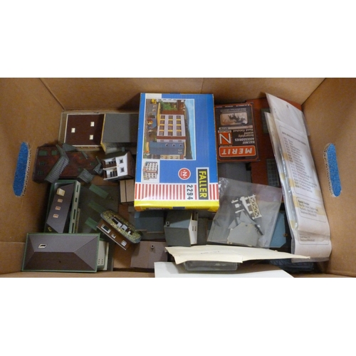 27 - Six cartons containing various model railway scale buildings, track, accessories etc.