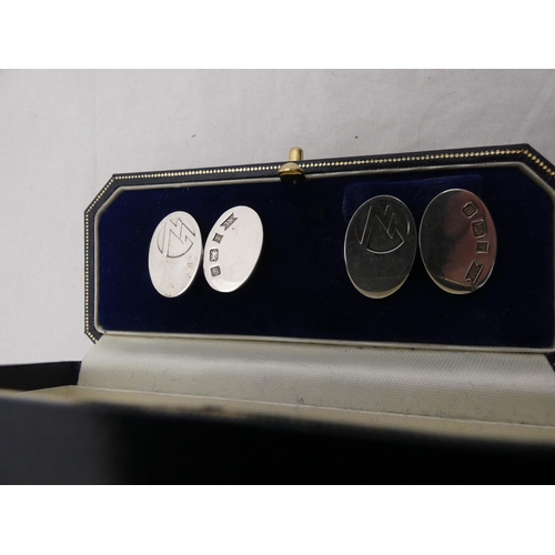 290 - Pair of silver cufflinks, in fitted case.