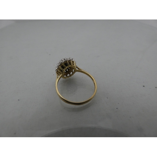 295 - 9ct gold lady's cluster ring, 2.6g gross.