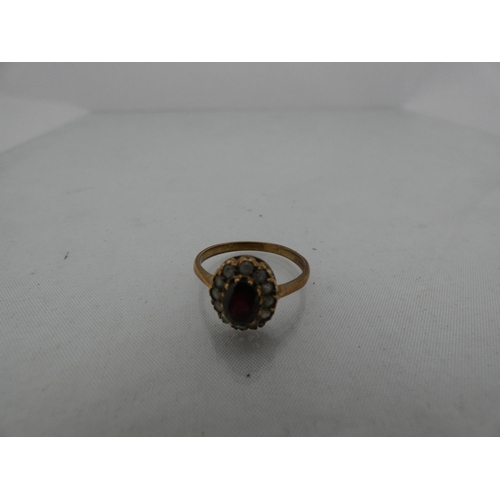 298 - 9ct gold lady's cluster ring, 2.2g gross.