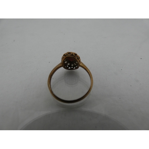 298 - 9ct gold lady's cluster ring, 2.2g gross.