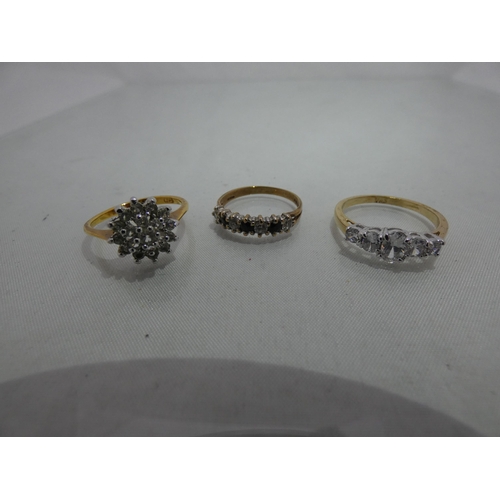 302 - 9ct gold lady's seven-stone dress ring, 1.7g gross, and two lady's costume rings.  (3)