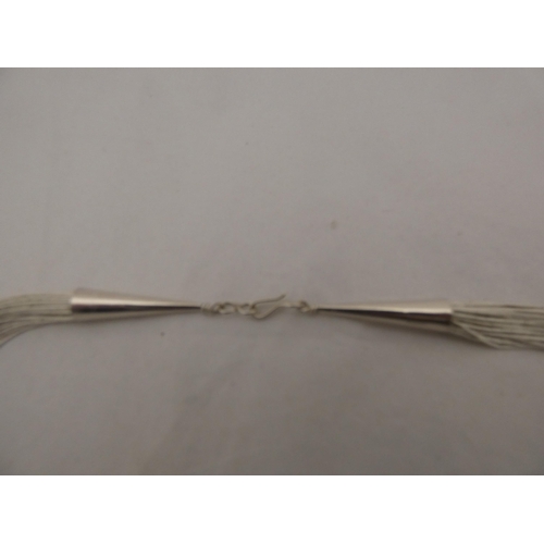 305 - Sterling silver wire chain with pendant, approximately 66g gross.