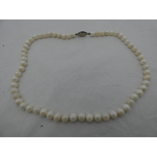 308 - Strand of cultured pearls, approximately sixty in total, 26.5g gross.