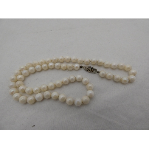 308 - Strand of cultured pearls, approximately sixty in total, 26.5g gross.