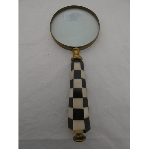 310 - Three brass-mounted magnifying glasses, one with a bone handle.