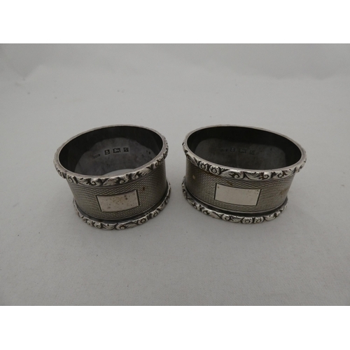 325 - Five silver napkin rings to include engine-turned examples, 163g gross.