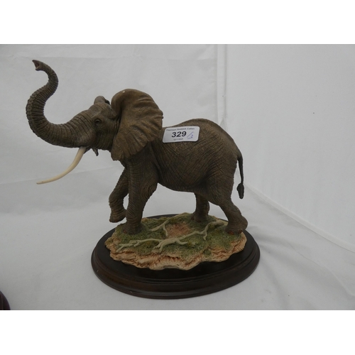 329 - Country Artists limited edition hand crafted figure of a bull elephant, no. CA948, a similar figure ... 