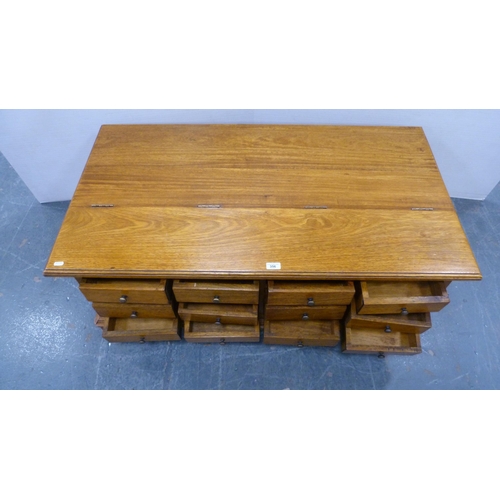 356 - Panelled storage chest with apothecary-style drawers to the front and hinged top.