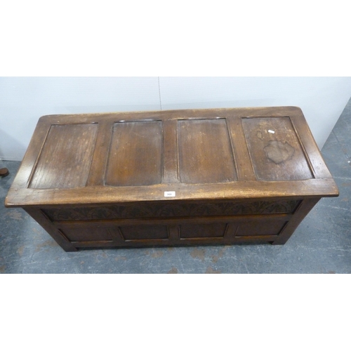 360 - Oak coffer with four-section panelled hinged top and carvings to the frieze.