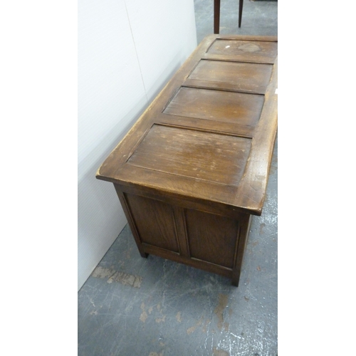 360 - Oak coffer with four-section panelled hinged top and carvings to the frieze.