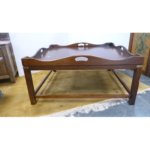 374 - Large stained wood coffee table with tray top.