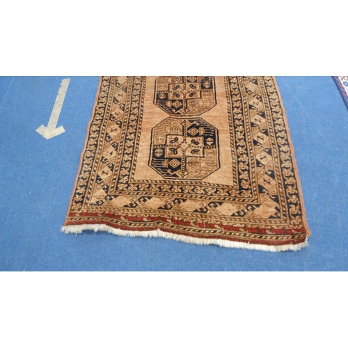 379 - Afghan Bokhara hand-knotted rug with four geometric medallions to the centre, red and black field on... 