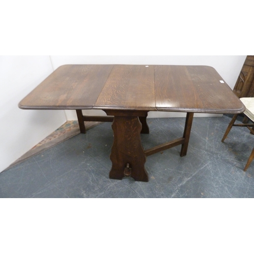 386 - Oak peg-jointed gate-leg table and a set of four Ercol Windsor-style quaker chairs.  (5)