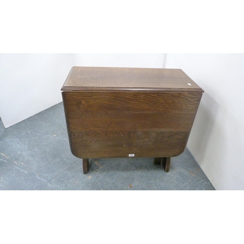 386 - Oak peg-jointed gate-leg table and a set of four Ercol Windsor-style quaker chairs.  (5)