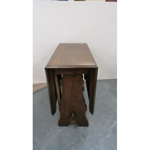 386 - Oak peg-jointed gate-leg table and a set of four Ercol Windsor-style quaker chairs.  (5)