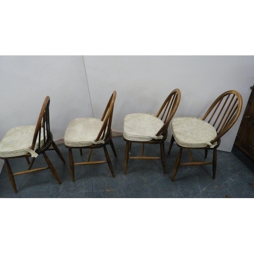 386 - Oak peg-jointed gate-leg table and a set of four Ercol Windsor-style quaker chairs.  (5)