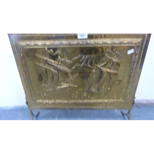 392 - Brass-coated fire screen.