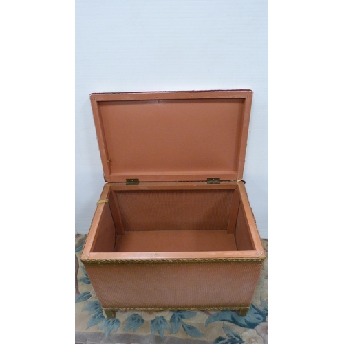 394 - Lloyd Loom-style pink wicker storage box with padded top.